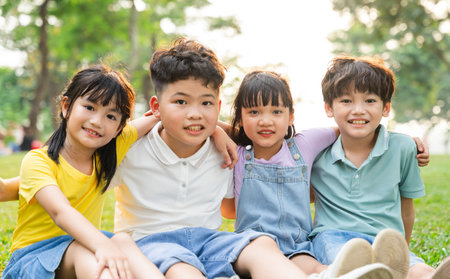 group of cute asian kids having fun in the parkの写真素材