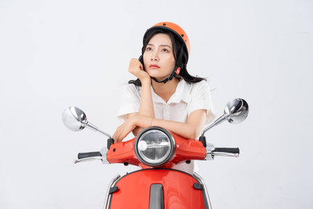 a woman wearing a helmet and driving a motorcycle