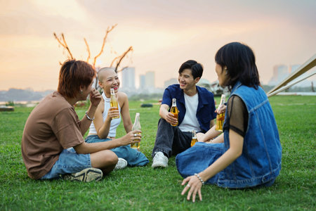 Image of group of friends celebrating and drinking beer together