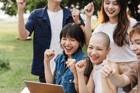 Image of a group of Asian students studying togetherの写真素材