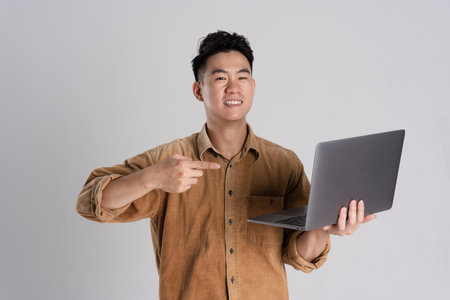 Portrait of Asian male businessman posing on white backgroundの写真素材