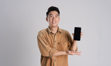 Portrait of Asian male businessman posing on white backgroundの写真素材