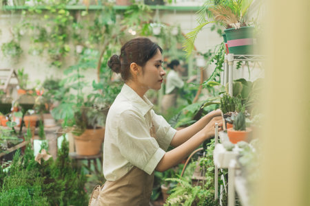 Portrait of Asian woman working in a plant shopの写真素材