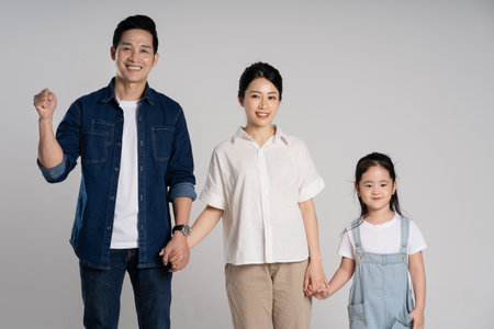 Asian family portrait posing on white backgroundの写真素材