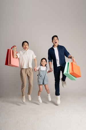 Asian family portrait posing on white backgroundの写真素材