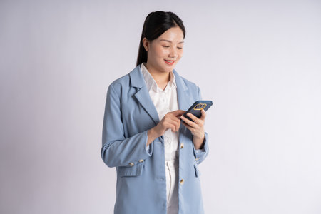 Portrait of young businesswoman posing on white backgroundの写真素材
