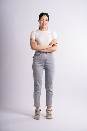 Portrait of beautiful Asian woman posing on white background