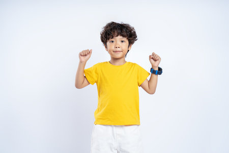 Portrait of beautiful Asian boy posing on white background, child