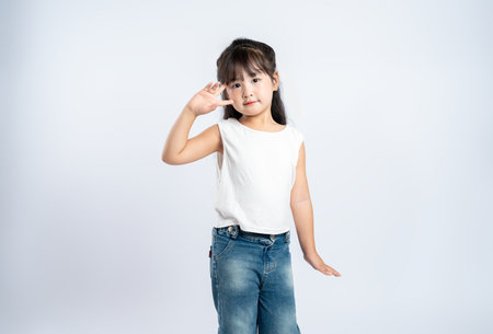 Portrait of beautiful Asian girl posing on white background, childの写真素材