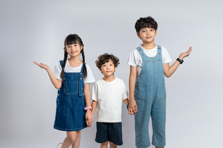 group image of cute asian kids posing on white backgroundの写真素材
