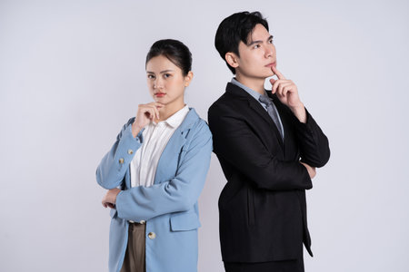 Image of an Asian business couple posing on a white backgroundの写真素材