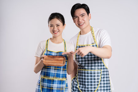 Image of Asian couple posing on white backgroundの写真素材