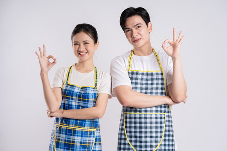 Image of Asian couple posing on white backgroundの写真素材