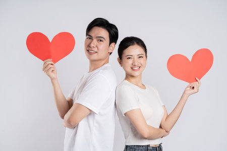 Image of Asian couple posing on white backgroundの写真素材