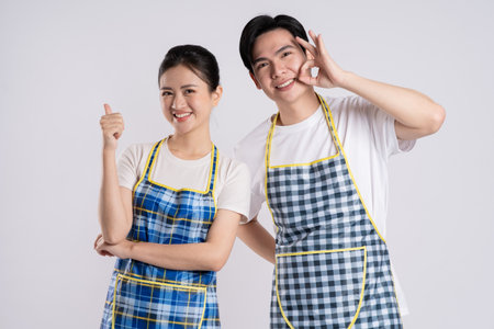 Image of Asian couple posing on white backgroundの写真素材