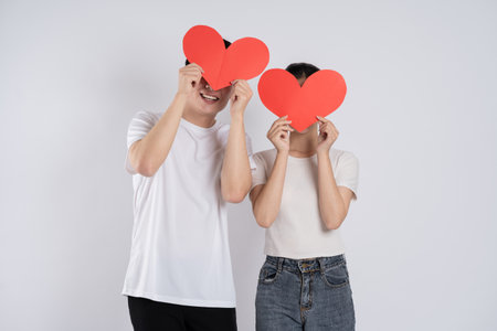 Image of Asian couple posing on white backgroundの写真素材