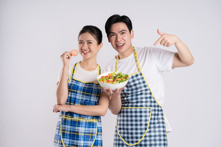 Image of Asian couple posing on white backgroundの写真素材