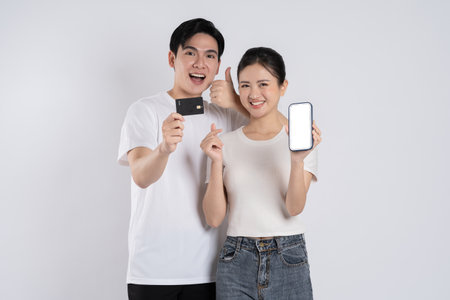 Image of Asian couple posing on white background