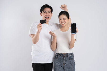 Image of Asian couple posing on white backgroundの写真素材