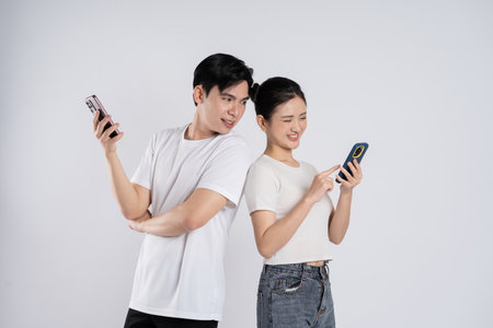 Image of Asian couple posing on white background
