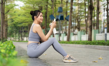 Portrait of Asian girl exercising at the parkの写真素材