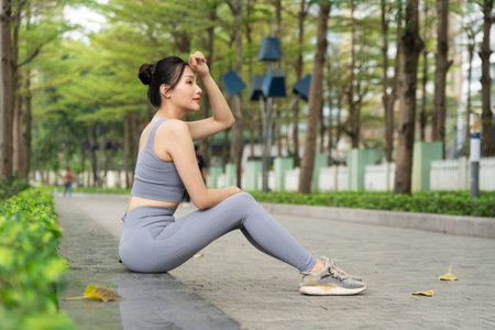 Portrait of Asian girl exercising at the parkの写真素材
