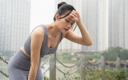 Portrait of Asian girl exercising at the parkの写真素材