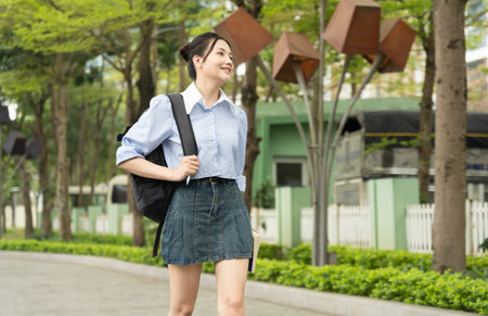 Portrait of female college student in the parkの写真素材