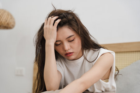 Portrait of beautiful young Asian girl at home
