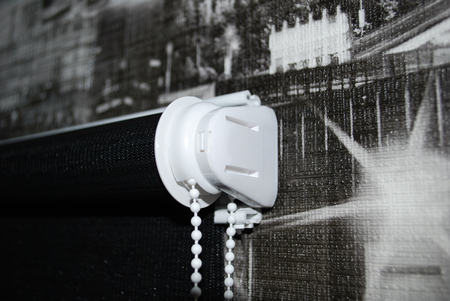 Black roller blind on a background of black abstract wallpaper.の写真素材