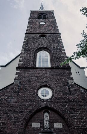 Church brick tower from front viewの写真素材