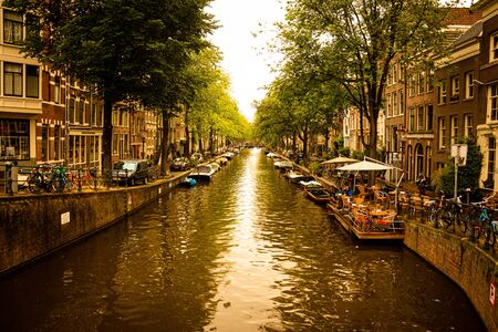 Amsterdam/Niederlande/ July 18, 2019: Golden summer on the canals of Amsterdam with boats and yachts...