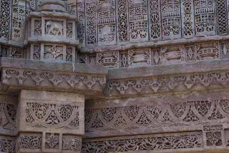 Ahmedabad / India / April 11, 2017: Sculpted details in sandstone by human hand in Indiaのeditorial素材