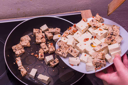 Frying two sorts of vegetarian tofu in the panの写真素材