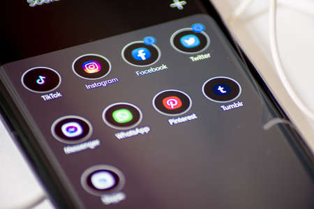 Vienna / Austria / November 13, 2020: Tik tok, instagram, facebook and other social media apps in the group on black the smartphoneのeditorial素材