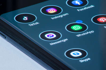 Vienna / Austria / November 13, 2020: one notification on WhatsApp application placed between other appsのeditorial素材