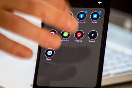 Vienna / Austria / November 13, 2020: Reaching facebook social media application on the black smartphoneのeditorial素材