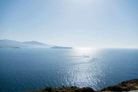 View over the sea taken from a hill with a low sun. Taken at Lesbos, Greeceの写真素材