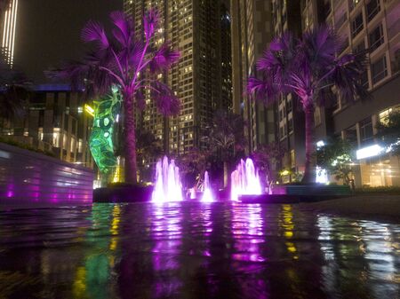 Water fountain with neon lightsの写真素材