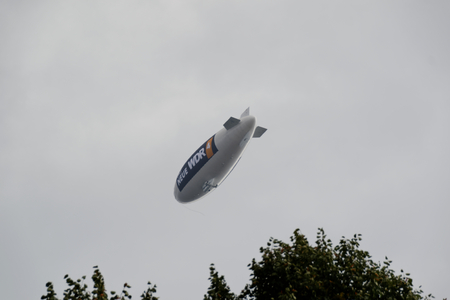 Modern airship New WDR flying promotional tour over Essen, Germanyのeditorial素材