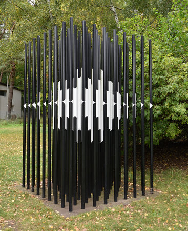 3d rendering of a metal fence made of black and white barsの写真素材
