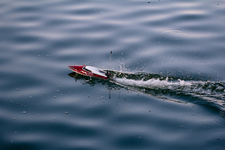 Remote control boat in the blue lakeの写真素材