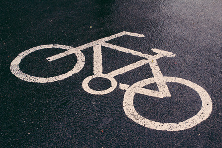 Bicycle sign on the road after the rain,Beijingの写真素材