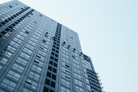 Group of Cleaners are cleaning windows of a office buildingの写真素材
