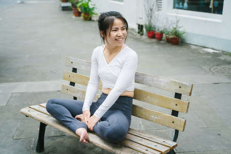 Young woman practice yoga in the parkの写真素材