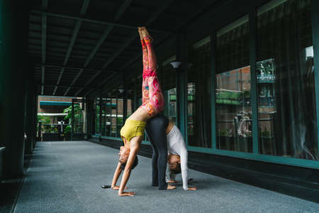 Young woman practice yoga in the parkの写真素材