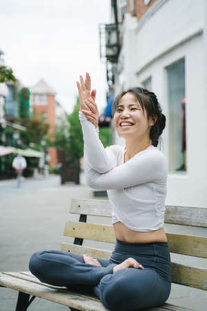 Young woman practice yoga in the parkの写真素材
