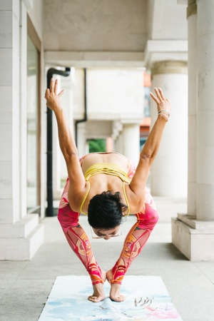 Young woman practice yoga in the park