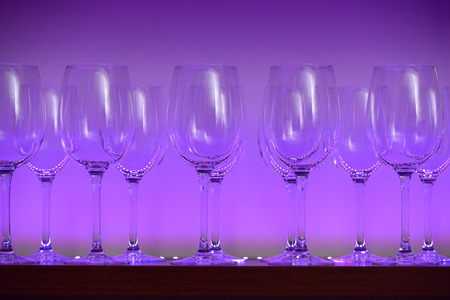 Beautiful glasses on a shelf in a restaurantの写真素材