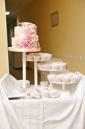 Beautiful and delicious cup cakes and wedding cakeの写真素材